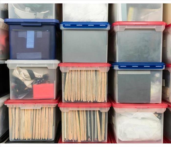 Documents inside plastic bins